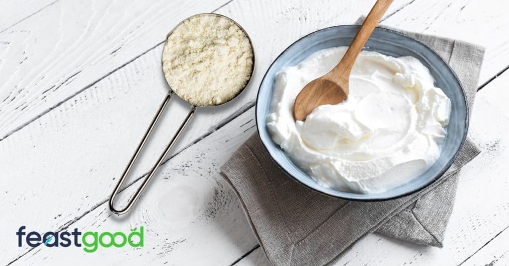 Protein powder will dissolve in Greek yogurt. It is relatively easy to do with a spoon and some vigorous stirring. 